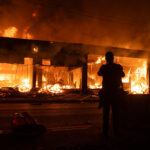 A building on fire on Lake Street in South Minneapolis on the 4th day of protests in Minneapolis following the death of George Floyd.