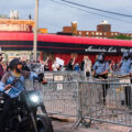 A man on a motorcycle yells at Minneapolis Police who are outside the 3rd Precinct as protesters continue to gather on the 2nd day of protests in Minneapolis following the death of George Floyd.