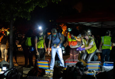 Community medics tend to those injured at protests outside the Minneapolis Police 3rd Precinct on May 28, 2020.