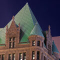 Minneapolis City Hall and the Hennepin County Government Center in downtown Minneapolis on a clear night.