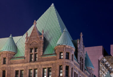 Minneapolis City Hall and the Hennepin County Government Center in downtown Minneapolis on a clear night.