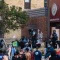 Protesters and Minneapolis police outside the third precinct on May 27th, 2020, the second day of protests following the death of George Floyd.
