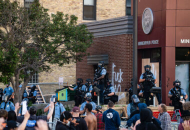 Protesters and Minneapolis police outside the third precinct on May 27th, 2020, the second day of protests following the death of George Floyd.
