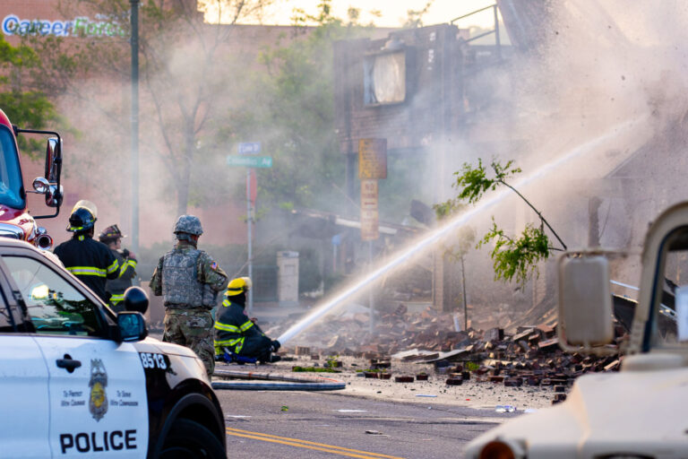 National Guard, Minneapolis Police and Fire Department 2 Minnesota National Guard and Minneapolis Police look on as the Minneapolis Fire Department fight fires on Lake Street after another night of protests and riots in Minneapolis after the death of George Floyd.