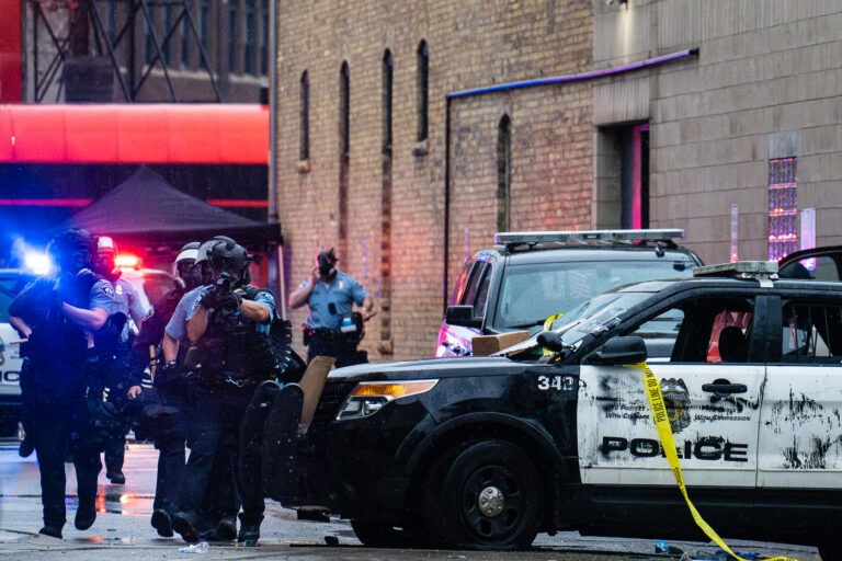 Minneapolis Police push protesters away from the precinct 2 Minneapolis Police fire less lethal weapons pushing people away from the third precinct. Protesters marched from the site of George Floyd's death to the precinct.