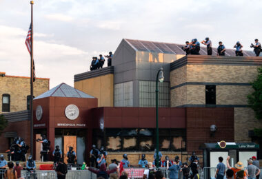 Minneapolis police on the roof of the third precinct.