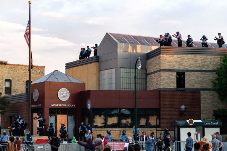 Minneapolis Police on the roof of the 3rd Precinct 1 Minneapolis police on the roof of the third precinct.