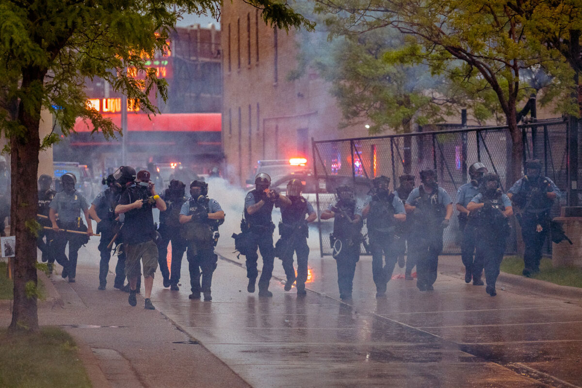 Minneapolis police continue to push protesters and media away from the third precinct.