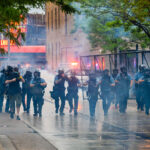 Minneapolis police continue to push protesters and media away from the third precinct.