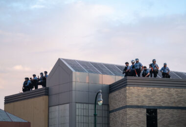 Minneapolis Police on the roof of the 3rd Precinct as protesters gathered outside following the killing of George Floyd days earlier.