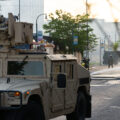 The Minnesota National Guard guards the Minneapolis Fire Department as they work to put out fires following nights of protests in Minneapolis following the death of George Floyd.