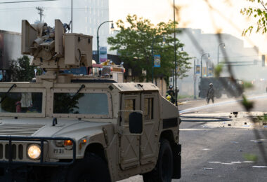 The Minnesota National Guard guards the Minneapolis Fire Department as they work to put out fires following nights of protests in Minneapolis following the death of George Floyd.