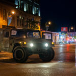 The Minnesota National Guard on Lake Street on May 30, 2020 while Minneapolis Fire Department puts out nearby fires on the 4th day of protests in Minneapolis following the death of George Floyd.