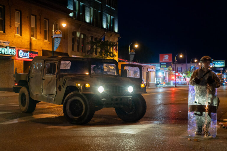 Minnesota National Guard on Lake Street during the Minneapolis U 1 The Minnesota National Guard on Lake Street on May 30, 2020 while Minneapolis Fire Department puts out nearby fires on the 4th day of protests in Minneapolis following the death of George Floyd.