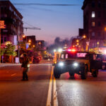 The Minnesota National Guard on Lake Street in Uptown Minneapolis on May 30, 2020 as the sunrises during the Minneapolis Uprising.