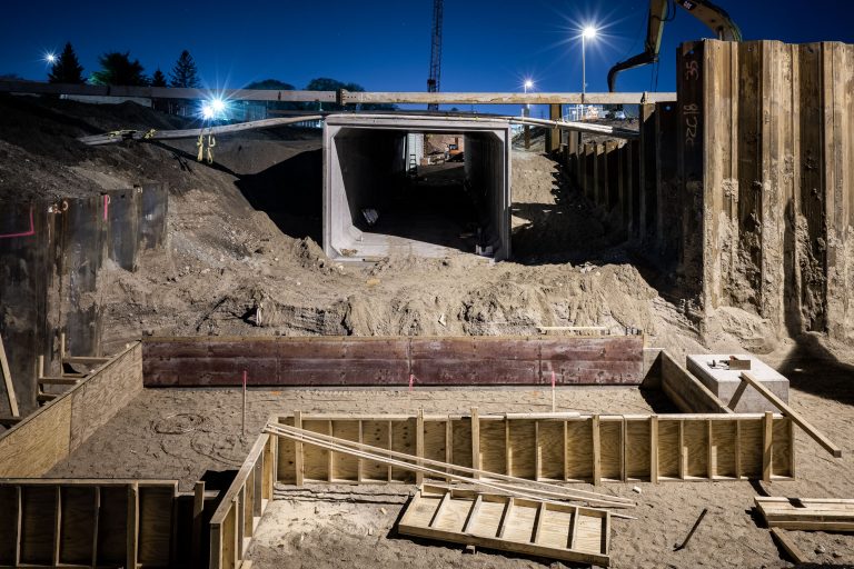 Construction of the Cedar Lake Trail tunnel under Wooddale Avenue in St. Louis Park at night.