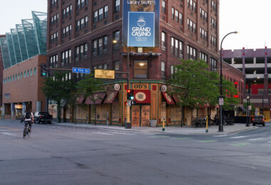 A biker bikes down N 7th St on May 28, 2020  in front of a boarded up O'Donovan's Irish Pub in Downtown Minneapolis on the 3rd day of protests in Minneapolis following the death of George Floyd.