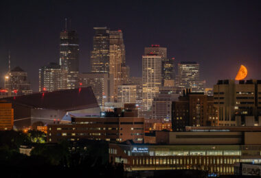 An orange moon over Downtown Minneapolis during a night of fires on the 4th day of protests in Minneapolis following the death of George Floyd.