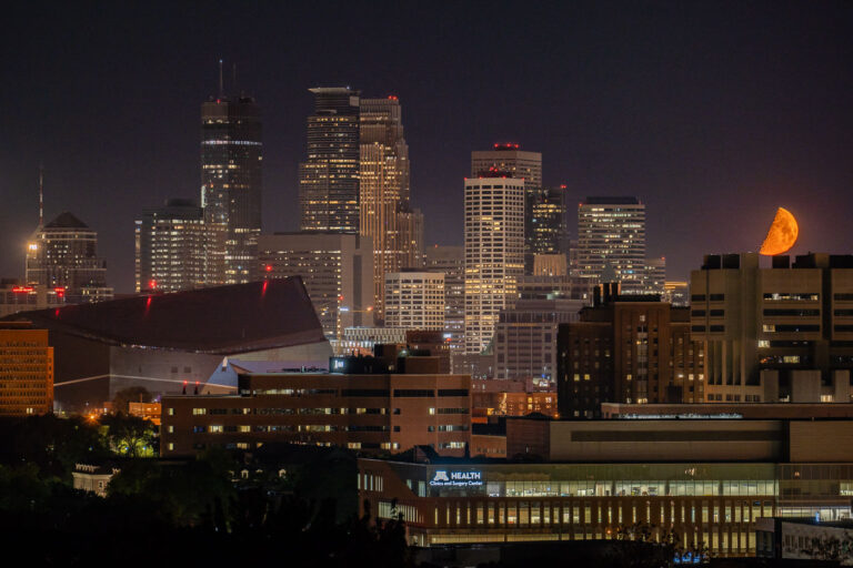 An orange moon over Downtown Minneapolis 3 An orange moon over Downtown Minneapolis during a night of fires on the 4th day of protests in Minneapolis following the death of George Floyd.