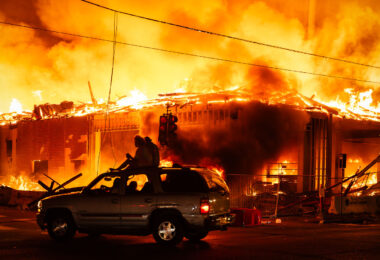 A 6-story new housing development on fire near the Minneapolis Police 3rd Precinct during the 2nd day of protests in Minneapolis following the death of George Floyd.
