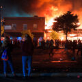 GM Tobacco and other buildings burn on Lake Street burning during the 3rd day of protests in Minneapolis following the death of George Floyd.