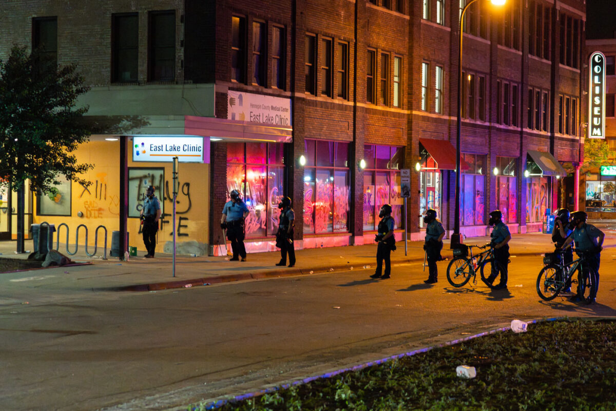 Minneapolis Police in riot gear outside the Coliseum Building on 27th Ave S on the 2nd day of protests in Minneapolis following the death of George Floyd.