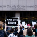 A protester holds up a sign reading "Black Lives Matter" outside the Hennepin County Government Center on May 28, 2020.