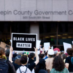 A protester holds up a sign reading "Black Lives Matter" outside the Hennepin County Government Center on May 28, 2020.