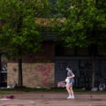 A woman holding jugs of milk outside the Minneapolis Police 3rd Precinct during protests the day after George Floyd was killed.