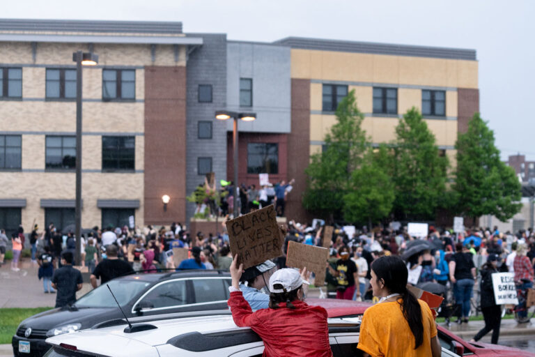 Protesters surround the Minneapolis Police 3rd Precinct 2 Protesters surround the Minneapolis Police 3rd Precinct. The large crowd marched the 2 miles from 38th St and Chicago Ave the day after George Floyd was killed.