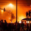 Protesters outside the burning Minneapolis Police 3rd Precinct. The precinct was lit on fire after being overrun by protesters on the 3rd day of protests in Minneapolis following the death of George Floyd.