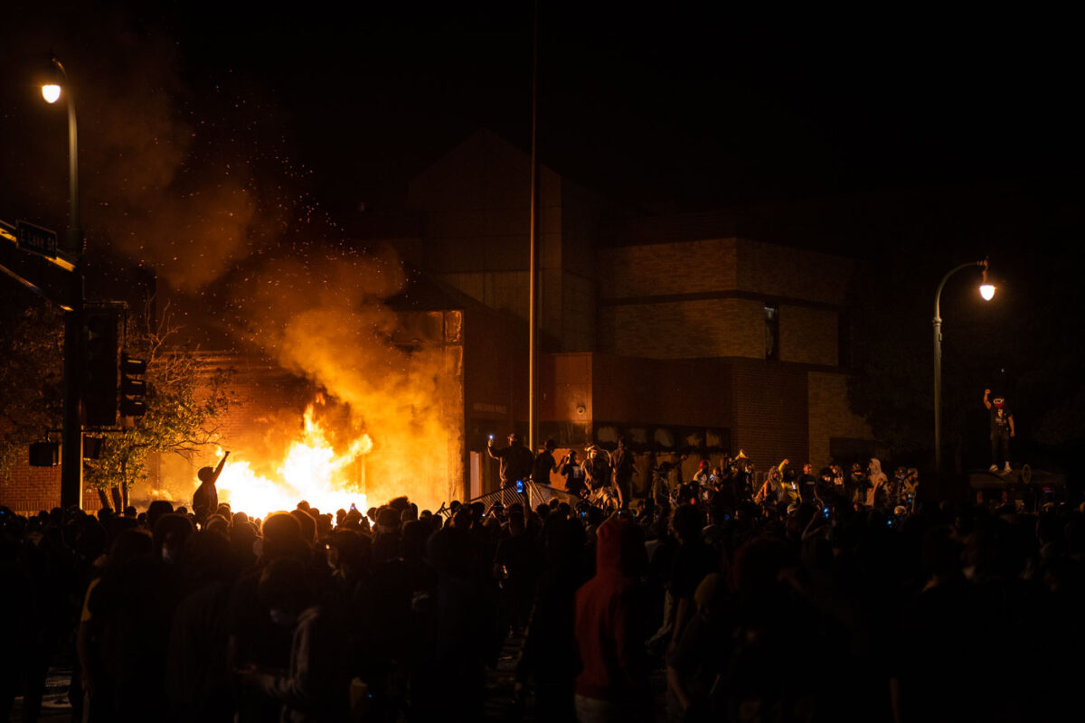 Protesters around the burning Minneapolis Police third precinct on the evening of May 28th, 2020. Protesters began gathering around the precinct days earlier following the death of George Floyd. Hours earlier,  Minneapolis Police vacated the precinct. The third precinct was the home precinct to Derek Chauvin who was ultimately convicted in the murder.