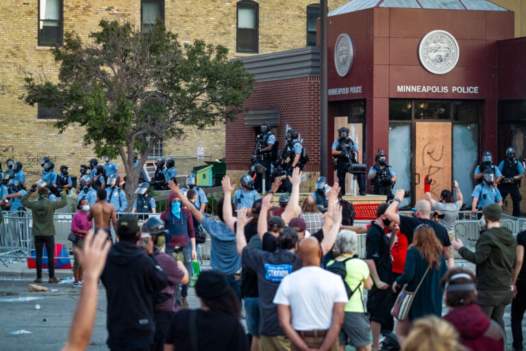 Minneapolis Police Third Precinct 2 Protesters chanting "hands up don't shoot!" and "George Floyd!" outside the Minneapolis police third precinct.