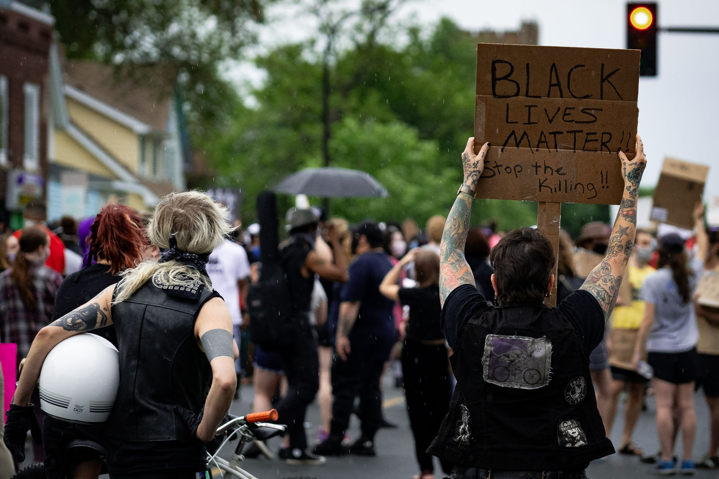 Proteter holds up a Black Lives Matter protest sign