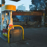 A car drives by a Shell gas station on Lake Street in Minneapolis on the morning of May 30, 2020 after nights of fires in Minneapolis.