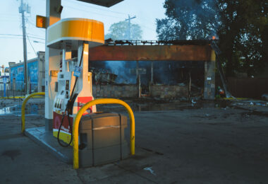 A car drives by a Shell gas station on Lake Street in Minneapolis on the morning of May 30, 2020 after nights of fires in Minneapolis.
