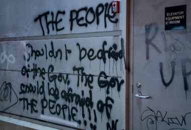 "The people shouldn't be afraid of the gov. The gov should be afraid of the people!!!" written on the Midtown train station.