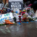 Flowers, signs and bears left behind on May 26, 2020 at a memorial where George Floyd was killed the night before.