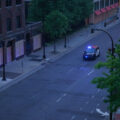 A Minneapolis Police squad car in front of S 10th St boarded up businesses on the 4th day of protests in Minneapolis following the death of George Floyd.