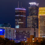 The Capella Tower, IDS Center, and Wells Fargo Center in Downtown Minneapolis at night.