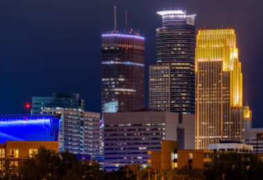 The Capella Tower, IDS Center, and Wells Fargo Center in Downtown Minneapolis at night.