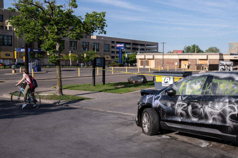US Bank Lake Street 1 A smashed up car outside of the looted US Bank building on Lake Street.