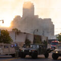 The Minnesota National Guard guards the Minneapolis Fire Department as they work to put out fires following nights of protests in Minneapolis following the death of George Floyd.