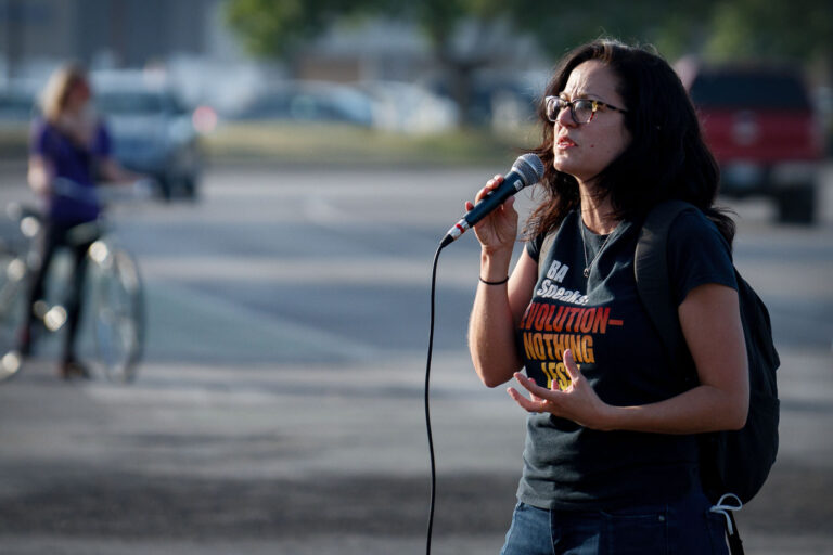 Sunsara Taylor from the Revolutionary Communist Party 1 Sunsara Taylor speaks on behalf of The Revolutionary Communist Party outside the third precinct.