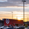 The sun sets behind Target, across from the Minneapolis police 3rd precinct.