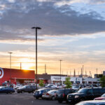 The sun sets behind Target, across from the Minneapolis police 3rd precinct.