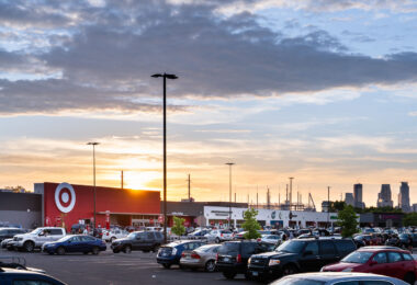The sun sets behind Target, across from the Minneapolis police 3rd precinct.