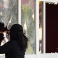 Someone takes a photo through the broken windows of the Target Store on East Lake Street.