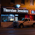 A man cleans up the inside of Thurston Jewelers which was broken into on the 2nd day of protests in Minneapolis following the death of George Floyd.