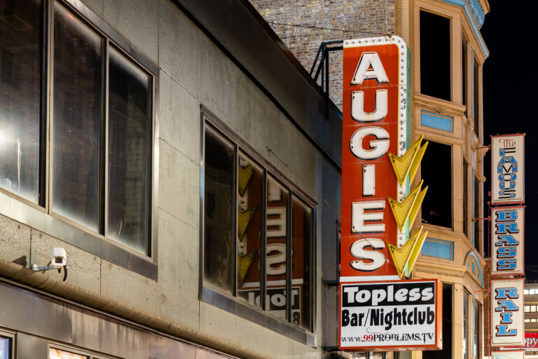Augies Topless Bar and Nightclub sign 4 Augies and The Famous Brass Rail signs in downtown Minneapolis.